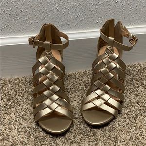 Gold chunky heel shoes.